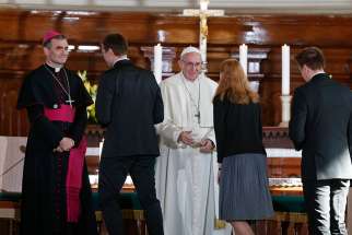  Pope Francis greets a young woman during an ecumenical encounter with young people at the Kaarli Lutheran Church in Tallinn, Estonia, Sept. 25. 