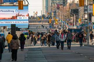 Torontonians &#039;take back&#039; the stretch of Yonge Street near Mel Lastman Square where a van attack killed 10 and injured 15 in Toronto.