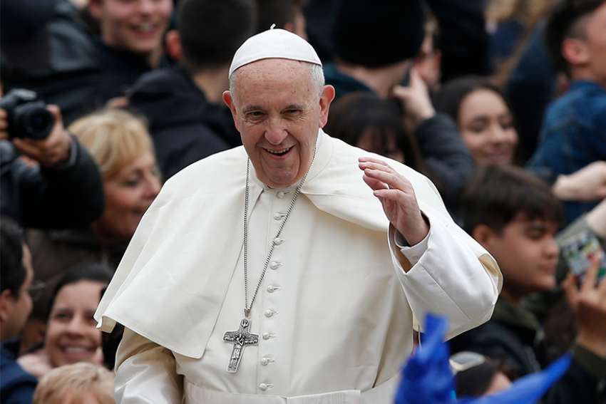 Pope Francis greets the crowd during his general audience in St. Peter&#039;s Square at the Vatican April 11. 
