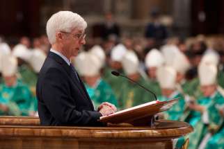 Ralph Martin, a professor at Sacred Heart Seminary in Detroit, reads the first reading as Pope Benedict XVI celebrates the closing Mass of the Synod of Bishops on the new evangelization in St. Peter&#039;s Basilica at the Vatican Oct. 28, 2012.