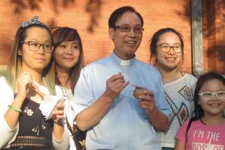 Fr. Joseph Tap Tran attracts young people to Vietnamese Martyrs Parish one ice cream scoop at a time. 