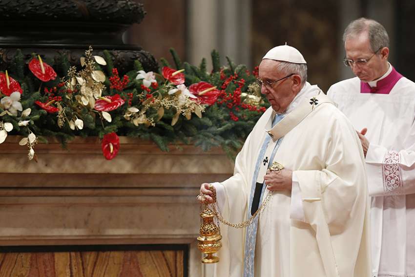 Pope Francis uses incense during a Mass marking the feast of Mary, Mother of God, in St. Peter&#039;s Basilica at the Vatican Jan. 1.