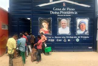 Migrants line up outside the Divine Providence Soup Kitchen in Cucuta Colombia, Feb. 9, 2019. For the past few years, church groups have been calling on Venezuelan President Nicolas Maduro to let humanitarian aid into the country, to relieve the suffering of millions of vulnerable Venezuelans. 