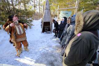 Huron-Wendat guide Simon Perusse explains how his nation prepared food during a March 10 meeting with members of the Canadian Religious Conference in Wendake, Quebec.