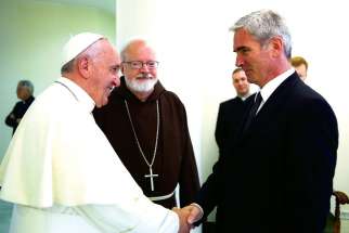 Mark Vincent Healy shakes hands with Pope Francis at the Vatican July 7. Healy, one of six abuse survivors who met the pope during a private meeting. The Pope has set up a special body to speed up the process of hearing and ruling on appeals of priests disciplined for abuse.