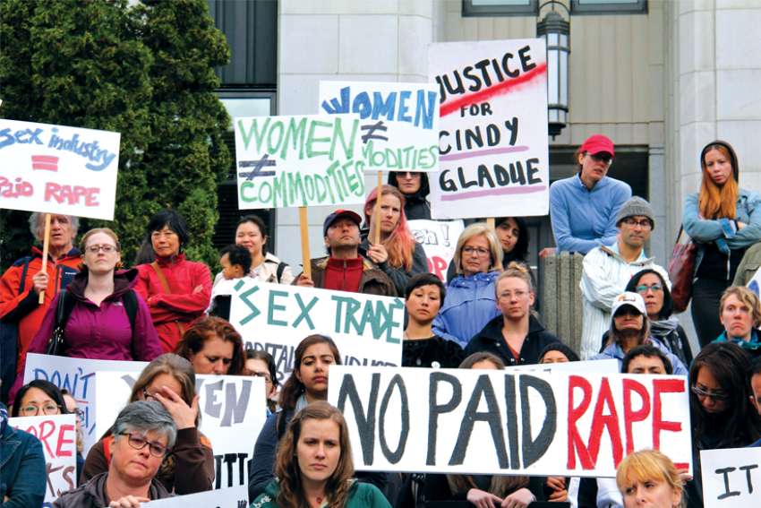 A protest at Vancouver City Hall in 2016 over the lack of enforcement of prostitution legislation. The Archdiocese of Vancouver has submitted a brief to the federal committee reviewing the law.