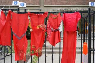 Students hung red dresses outside St. Joseph&#039;s College School to honour the 1,200 missing and murdered Indigenous women in Canada on Oct. 4.