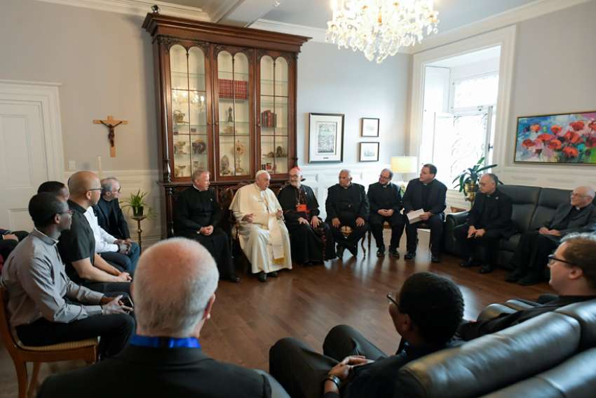 Pope Francis meets with Jesuits working in Canada during a meeting at the archbishop&#039;s residence in Quebec July 29, 2022. Pictured with the group is Cardinal Michael Czerny, prefect of the Dicastery for Promoting Integral Human Development.