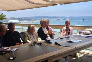 German director Wim Wenders, center, speaks during a panel discussion on May 25, 2017, in Cannes, France.