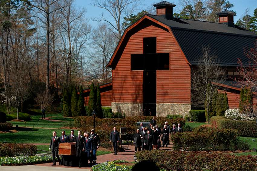 Pallbearers carry the Rev. Billy Graham&#039;s casket during his funeral service in Charlotte, N.C., March 2.