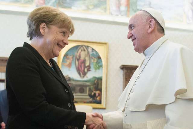 Pope Francis shakes hands with German Chancellor Angela Merkel in this picture dated Feb. 21, 2015.