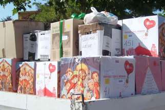 Christmas boxes are seen in mid-December on the back of a truck that is part of the &quot;Christmas With Brothers&quot; campaign, run by the Archdiocese of Santiago, Chile.