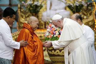 Pope Francis greets Bhaddanta Kumarabhivasma, chairman of the supreme council of Buddhist monks, during a Nov. 29 meeting with monks of the council at the Kaba Aye Pagoda in Yangon, Myanmar.