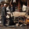 esidents gather at the site of a car bomb attack in late February in Baghdad. A decade after the 2003 invasion of Iraq by U.S.-led forces, Catholic observers say America has broad responsibilities to the Iraqi people for reparations in the aftermath of war and long occupation.