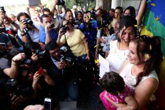 In this Dec. 14, 2013 file photo, a same-sex couple marries in Jalisco, Mexico. 