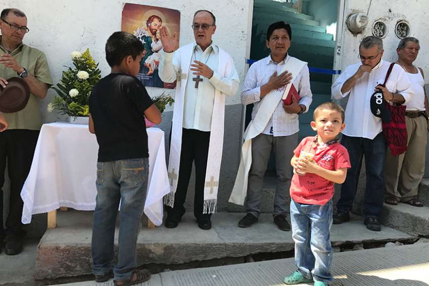 Mexican Coadjutor Bishop Enrique Diaz Diaz of San Cristobal de Las Casas blesses a new shelter for migrants Feb. 27 on the Mexico-Guatemala border. The shelter will house families seeking asylum in Mexico.