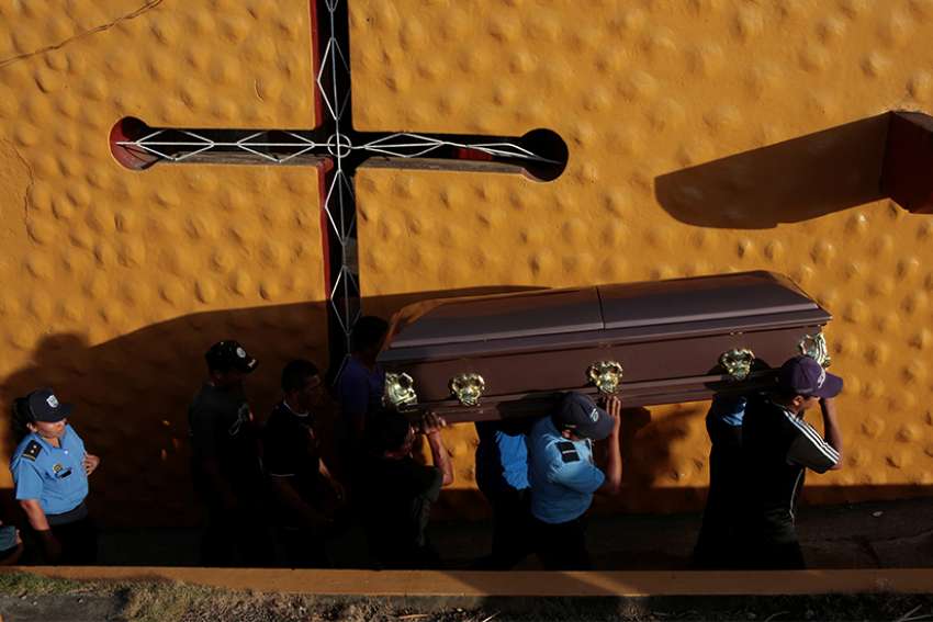  Police officers and relatives carry the coffin of an officer killed during the protests over pension plan reform April 24. The bishops&#039; conference of Nicaragua has accepted an invitation to mediate talks aimed at calming the Central American country.