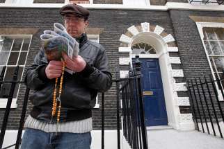 A pro-life activist holds a rosary stands outside an abortion clinic in 2012 in London. A prominent Catholic lawyer has expressed concern that local governments are considering exclusion zones around abortion clinics, with no proof anyone is harassing pregnant women.