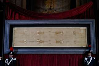 The Shroud of Turin is displayed during a preview for journalists at the Cathedral of St. John the Baptist in Turin, Italy, April 18. A public exposition of the shroud, believed by many to be the burial cloth of Jesus, runs from April 19 through June 24, 2015. 