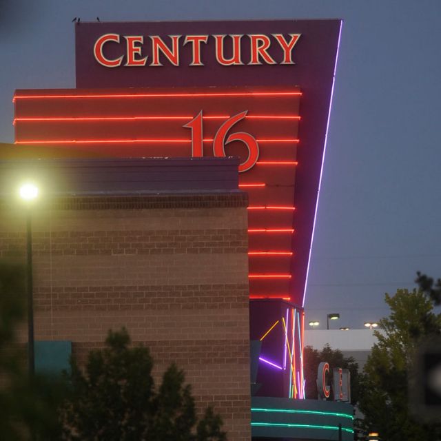 View of the Century 16 theater in Aurora, Colo., where a gunman killed at least a dozen people and injured many more during a midnight showing of the Batman movie &quot;The Dark Knight Rises&quot; July 20, 2012.  One year after the shooting, victims&#039; families still mourn for those lost.