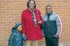 Magdalene Massicot and her grandsons pose in front of church in 2013. She died later that year.
