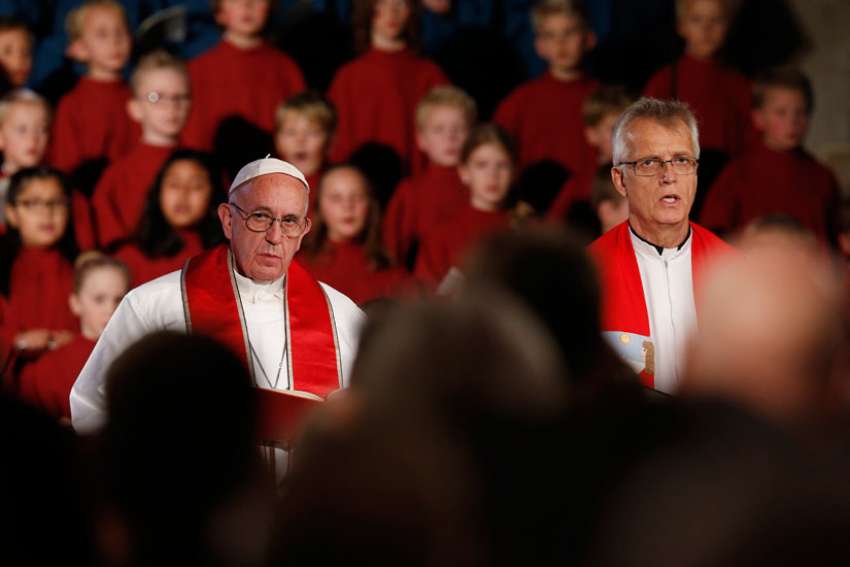 Pope Francis and the Rev. Martin Junge, general secretary of the Lutheran World Federation, attend an ecumenical prayer service at the Lutheran cathedral in Lund, Sweden, Oct. 31.