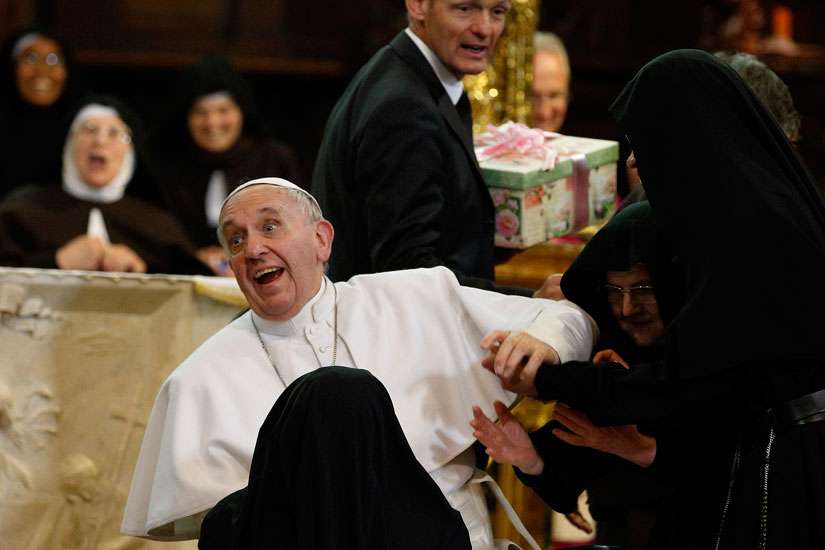 Nuns greet Pope Francis during his meeting with religious at the cathedral in Naples, Italy, March 21.