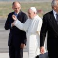 Pope Francis gestures as he talks with Italy&#039;s Prime Minister Enrico Letta before boarding a plane at Fiumicino airport in Rome July 22. Pope Francis departed for Brazil to join more than 300,000 young people for World Youth Day.
