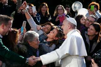  Pope Francis poses for a selfie as he greets the crowd outside St. Mary Josefa Church as he arrives to celebrate Mass at the parish in Rome 2017.