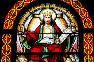 A stained-glass window depicting &quot;Christ the King and Lord of the Universe&quot; is seen in the Cathedral of St. Peter in Wilmington, Del.
