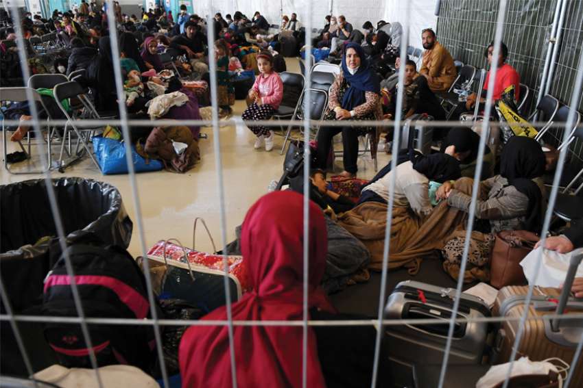Afghan refugees are processed at Ramstein Air Base in Germany Sept. 8. Canada has already taken in a number of the 20,000 refugees the federal government pledged to resettle.