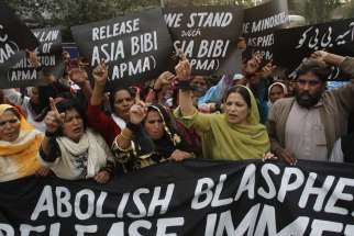 Protesters hold up placards while demanding the release of Asia Bibi, a Pakistani Christian woman who was sentenced to death for blasphemy, at a rally in Lahore. Bibi’s case led Raza Muhammad, who is seeking asylum in Canada, to renounce his radical Islamist faith to convert to Christianity. 