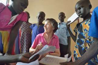 Irish Loreto Sister Rosemary Gallagher, who teaches at Loreto Primary School in Rumbek, South Sudan, works with students in late April. The Loreto Sisters began a secondary school for girls in 2008, with students from throughout the country, but soon after added a primary in response to local community demands.