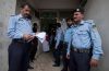 Police officers stand guard outside of a courtroom during a hearing at the district court in Islamabad Sept. 7. Rimsha Masih, a Pakistani Christian girl accused of blasphemy, was granted bail, a judge said, days after police detained a Muslim cleric who witnesses claim tore pages from a Quran and planted them along with burned pieces of paper in the girl&#039;s bag.