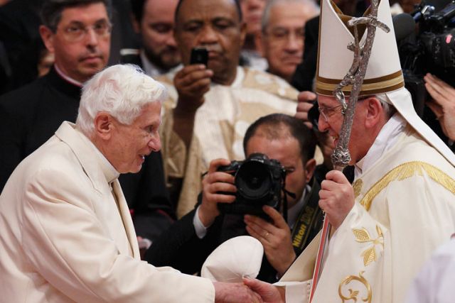 Retired Pope Benedict XVI greets Pope Francis at the conclusion of a consistory at which Pope Francis created 19 new cardinals in St. Peter&#039;s Basilica at the Vatican Feb. 22. Pope Benedict&#039;s presence at the ceremony marked the first time he had joined Po pe Francis for a public liturgy.