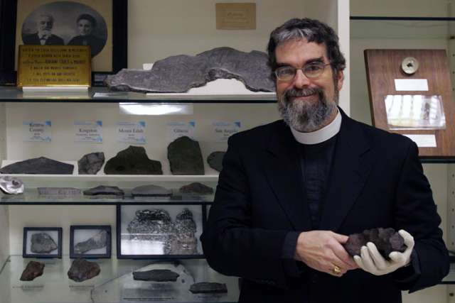 U.S. Jesuit Brother Guy Consolmagno, an astronomer with the Vatican Observatory, is pictured with the observatory&#039;s meteorite collection in this 2006 file photo.
