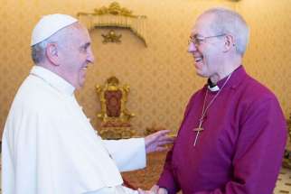 Pope Francis shakes hands with Anglican Archbishop Justin Welby of Canterbury, England, during a private meeting at the Vatican June 16.