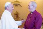 Pope Francis shakes hands with Anglican Archbishop Justin Welby of Canterbury, England, during a private meeting at the Vatican June 16.