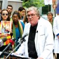 Dr. Philip Berger, chief of family and community medicine at St. Michael’s Hospital, addresses about 300 people protesting government cuts to the Interim Federal Health Program.