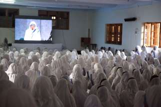 Missionaries of Charity nuns in Kolkata, India, watch St. Teresa&#039;s canonization broadcast live from Rome Sept. 4.