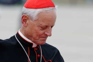 Cardinal Donald W. Wuerl is pictured as he waits for Pope Francis&#039; arrival at Andrews Air Force Base in Maryland near Washington Sept. 22, 2015. Cardinal Wuerl announced Sept. 11 that he will meet soon with Pope Francis to discuss the resignation he submitted three years ago when he turned 75. 