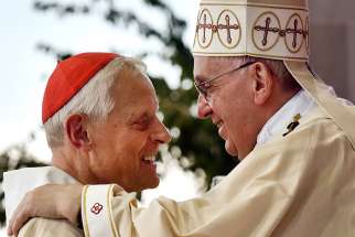  Pope Francis greets Washington Cardinal Donald W. Wuerl during a Mass in 2015 outside the Basilica of the National Shrine of the Immaculate Conception in Washington.