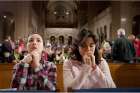 Regina Trovino and Daniela Haddad pray before the opening Mass of the National Prayer Vigil for Life at the Basilica of the National Shrine of the Immaculate Conception in Washington Jan. 24.
