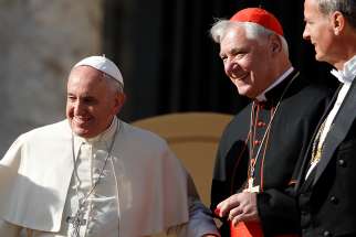 Pope Francis is pictured with Cardinal Gerhard Muller, then prefect of the Congregation for the Doctrine of the Faith, during his general audience in St. Peter&#039;s Square at the Vatican Nov. 19, 2014.