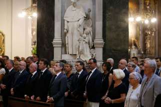 People attend a July 15 Mass at the Catholic cathedral in Nice, France, to pay tribute to victims of a Bastille Day attack. Pope Francis condemned the July 14 attack, calling it an act of &quot;blind violence.&quot;