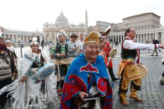 &#039;Assembly of First Nations representatives walk outside St. Peter&#039;s Square after performing in the square at the Vatican March 31, 2022.