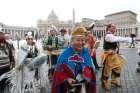 &#039;Assembly of First Nations representatives walk outside St. Peter&#039;s Square after performing in the square at the Vatican March 31, 2022.