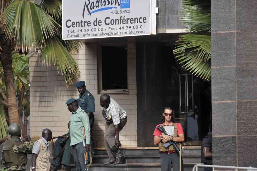 Security forces surround the Radisson Hotel during a hostage situation in Bamako, Mali, Nov. 20. The secretary-general of Mali&#039;s Catholic bishops&#039; conference has said he fears the bloody hotel attack forms part of a wider Islamist campaign, but insisted Catholic-Muslim ties will not be affected by the latest violence