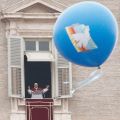 A balloon with an image of a dove floats as Pope Benedict XVI waves after leading the Angelus from the window of his apartment overlooking St. Peter&#039;s Square on the feast of Mary, Mother of God, and the the observance of World Peace Day at the Vatican Jan. 1.
