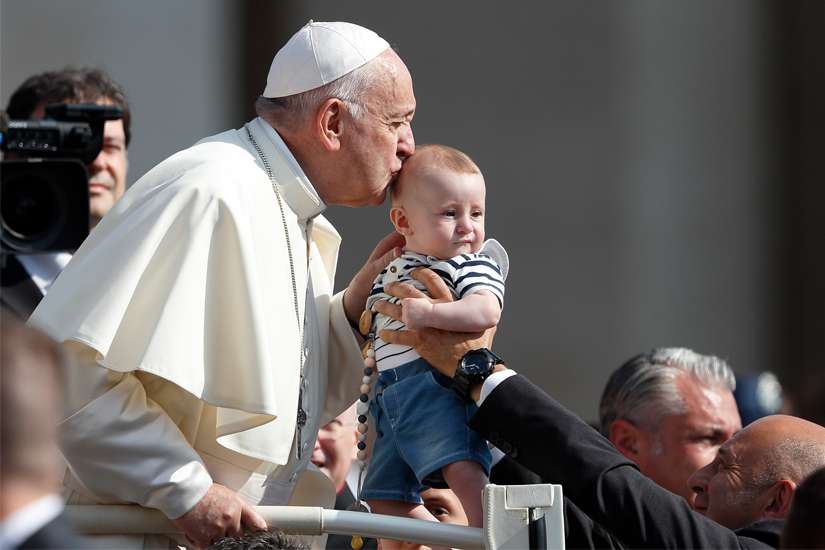 Pope Francis kisses a baby during his general audience in St. Peter&#039;s Square at the Vatican June 5, 2019.